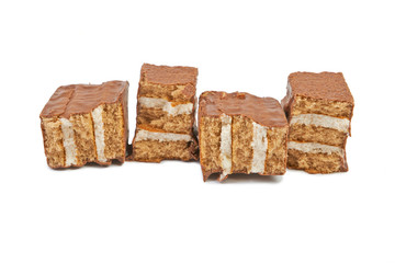 The broken pieces of chocolate biscuit isolated on white