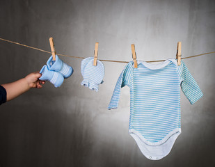 Baby clothes hanging on the clothesline.