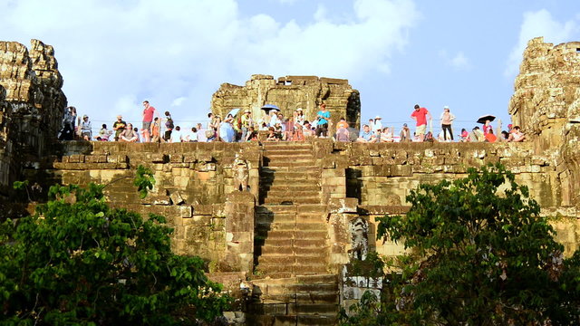 Zoom Out - Time Lapse - Tourists on top of Ancient Temple Waiting for the Sunset - Angkor Wat, Cambodia