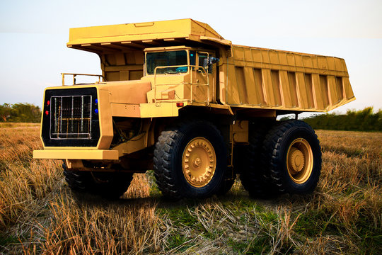 Heavy mining truck in mine and driving along the opencast.