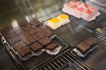 Display case with cheesecakes and brownies