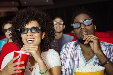 Young couple watching a 3d film