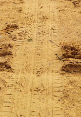 Fototapeta premium Wheel tracks on the soil.
