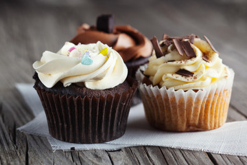 Chocolate cupcakes on wooden table