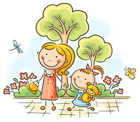 Mother and daughter walking in the park