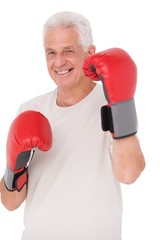 Senior man in boxing gloves