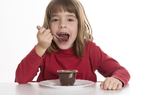 Little Girl Eating A Custard