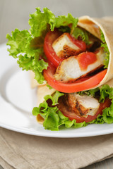 freshly made tortilla wraps with chicken and vegetables