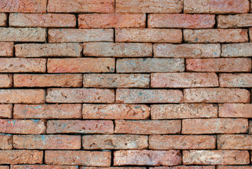 Fototapeta premium Porous red bricklaying without filling with cement