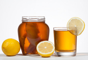Kombucha super food pro biotic beverage in glass with lemon on w