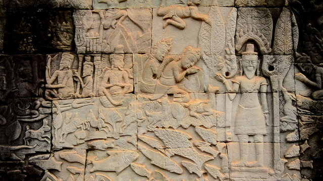Zoom out-  Stone Carving of Religious Icons on Temple Wall - Angkor Wat, Cambodia