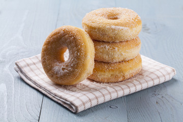 Fresh donut on blue table