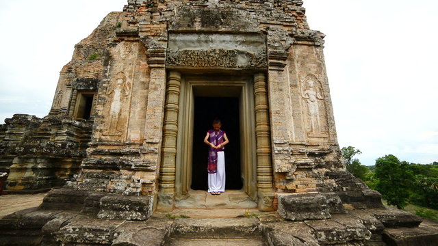Female Buddhist Praying with Incense in Temple Doorway -   Angkor Wat Temple Cambodia