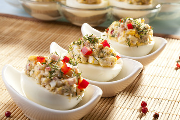 stuffed eggs with ham, red pepper and dill