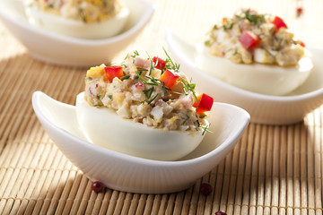stuffed eggs with ham, red pepper and dill