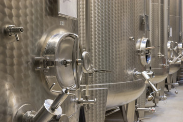 Contemporary steel barrels in winery, food industry