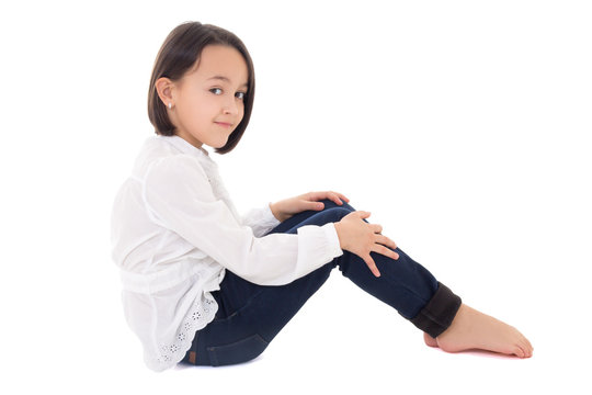 Portrait Of Little Beautiful Girl Sitting Isolated On White