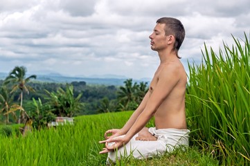 Man maditation on the rice fields