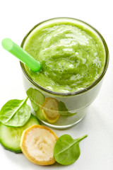 glass of banana, cucumber and spinach smoothie