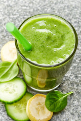 glass of banana, cucumber and spinach smoothie