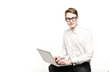 young man in glasses with laptop with emotion