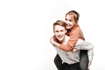 happy couple teenagers in studio