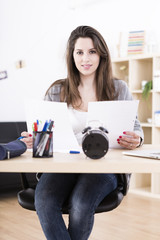 Beautiful young woman working and studying at home