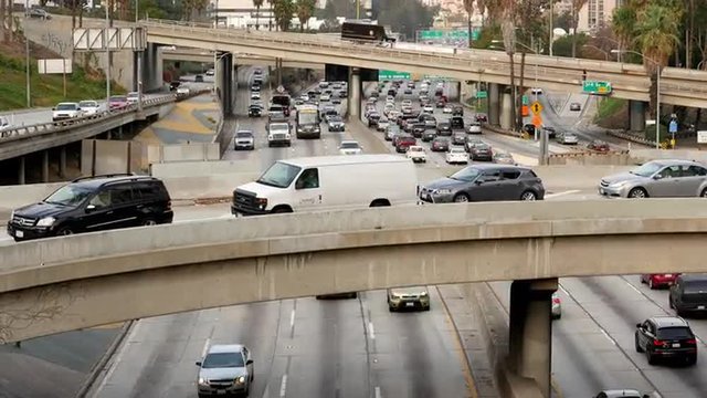Zoom Out / Time Lapse - Traffic on Busy Freeway in Downtown Los Angeles California