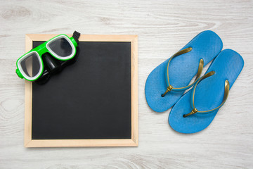 summer shoes, snorkel and blackboard