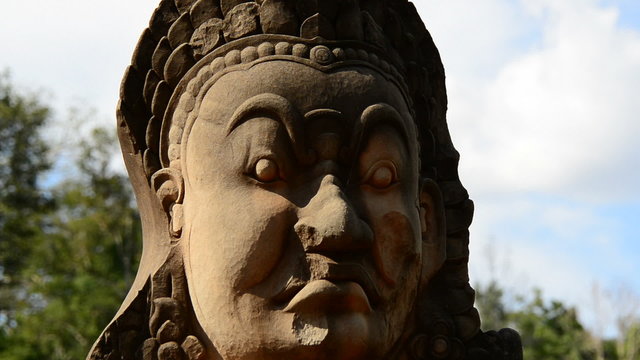 Zoom Out of Stone Statue of Buddha  - Angkor Wat, Cambodia