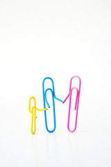 Obraz premium variety of colorful paper clips on white background