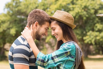 Fototapeta premium Young couple hugging in the park