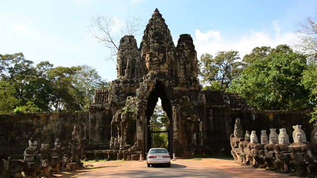 Cars Drive through Ancient Temple on Bridge - Angkor Wat Temple Cambodia