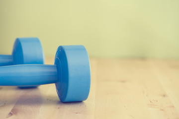 Two of dumbbells on the table- vintage style effect picture