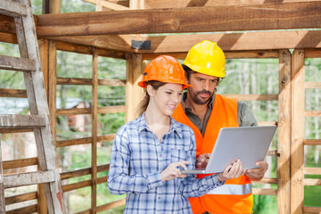 Engineers Working On Laptop At Construction Site