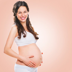 Happy pregnant woman touching her belly. Pregnancy