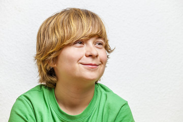 smiling boy sitting on a sofa