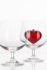 Red heart inside a glass of cognac