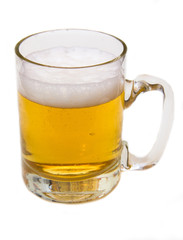 Mug of beer with froth over white background
