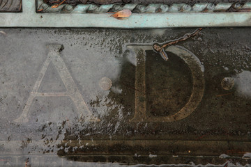 A.D. Anno Domini. Inscription on a bronze gravestone.