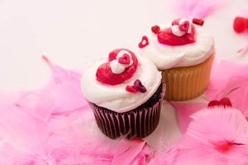 Valentines Day decorations and cupcakes with heart shaped frosti