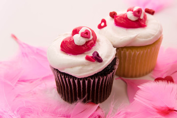 Valentines Day decorations and cupcakes with heart shaped frosti