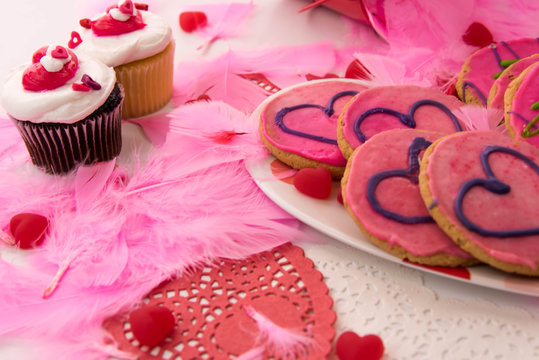 Valentines Day - pink cookies and cupcakes with hearts
