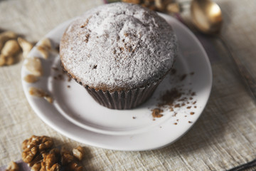 cake on a plate with nuts
