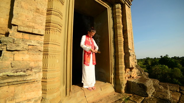 Female Buddhist Praying with Incense in Temple Doorway - Angkor Wat Temple Cambodia