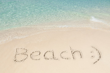 Beach And Smiley Face On Sand By Sea
