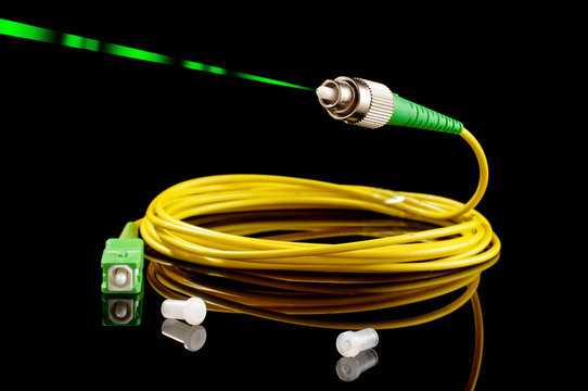 Green laser pulses from optical fiber