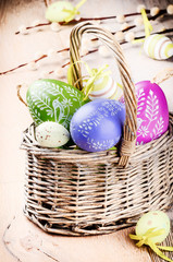 Colorful Easter eggs in basket