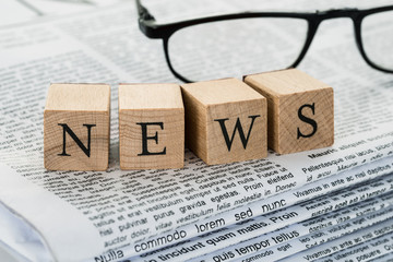 News Text On Wooden Blocks With Eyeglasses