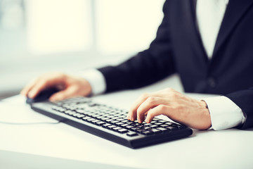man hands typing on keyboard